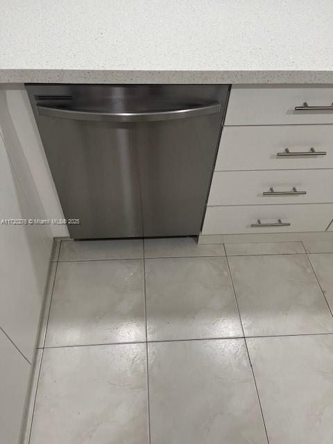 details with dishwasher and white cabinets