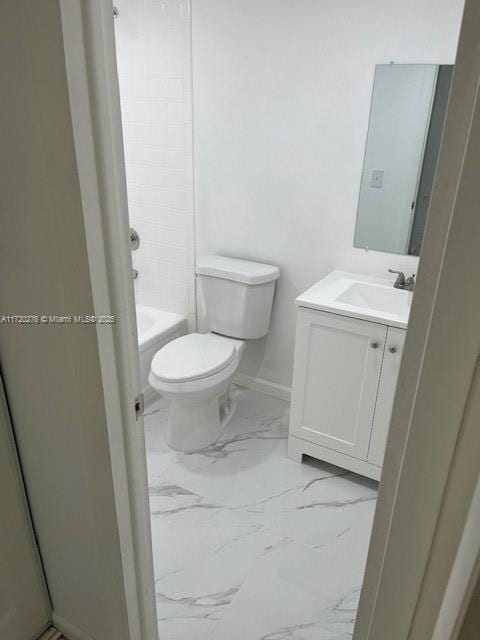 full bathroom featuring bathtub / shower combination, vanity, and toilet