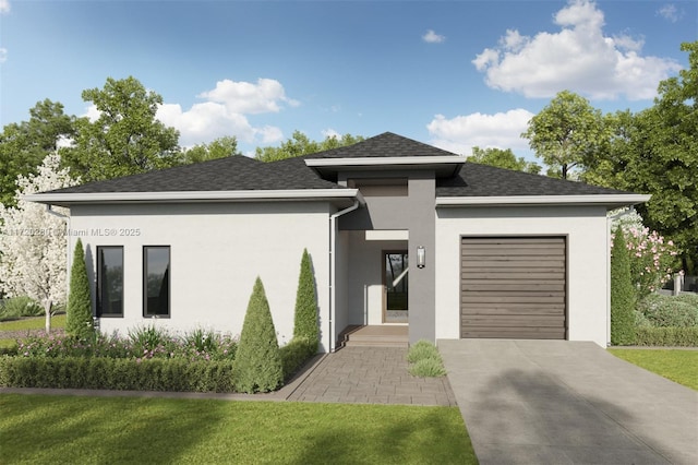 view of front of house with a garage and a front yard