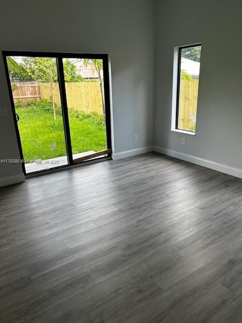 301 NW 28th Ave, Fort Lauderdale, FL 33311 - empty room with dark wood-style flooring
