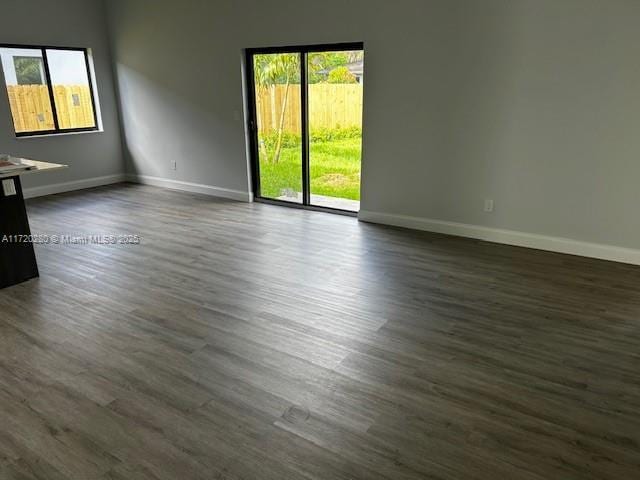 301 NW 28th Ave, Fort Lauderdale, FL 33311 - spare room with baseboards and dark wood finished floors