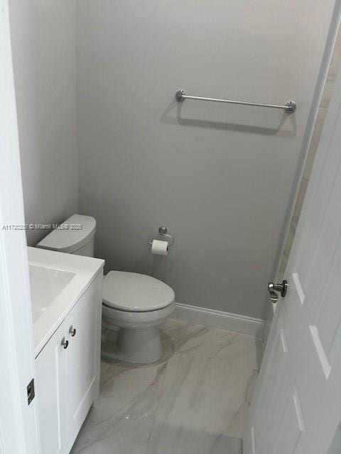 301 NW 28th Ave, Fort Lauderdale, FL 33311 - bathroom featuring marble look tiles and vanity