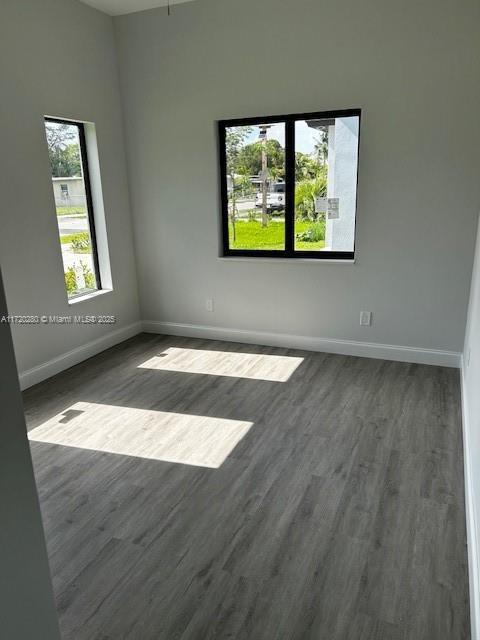301 NW 28th Ave, Fort Lauderdale, FL 33311 - empty room with dark wood-style floors