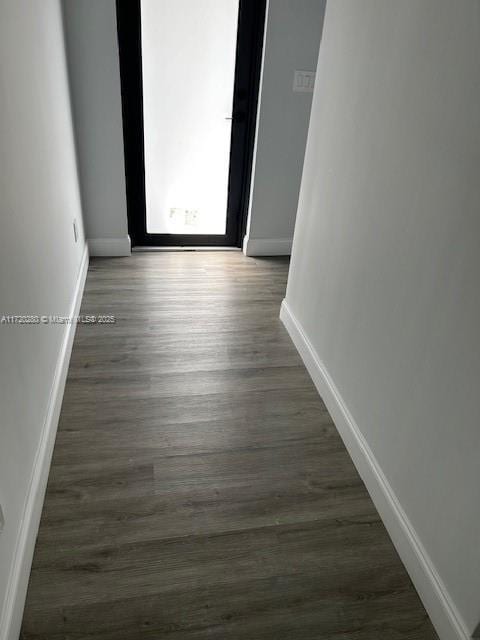 301 NW 28th Ave, Fort Lauderdale, FL 33311 - spare room featuring baseboards and dark wood-style flooring