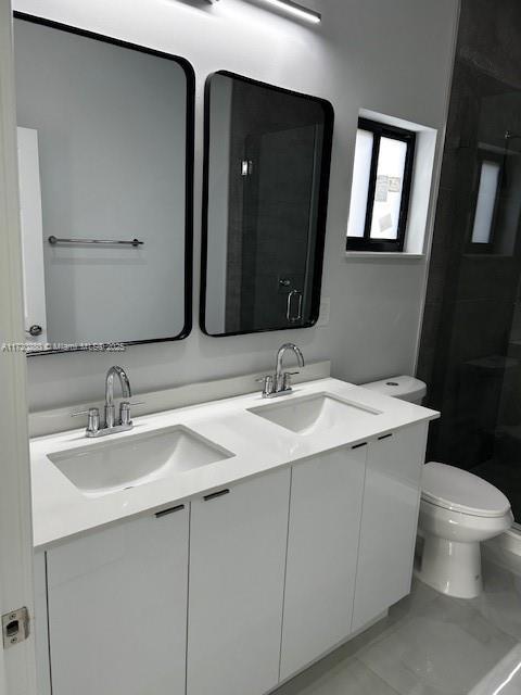 301 NW 28th Ave, Fort Lauderdale, FL 33311 - full bath featuring double vanity and a shower