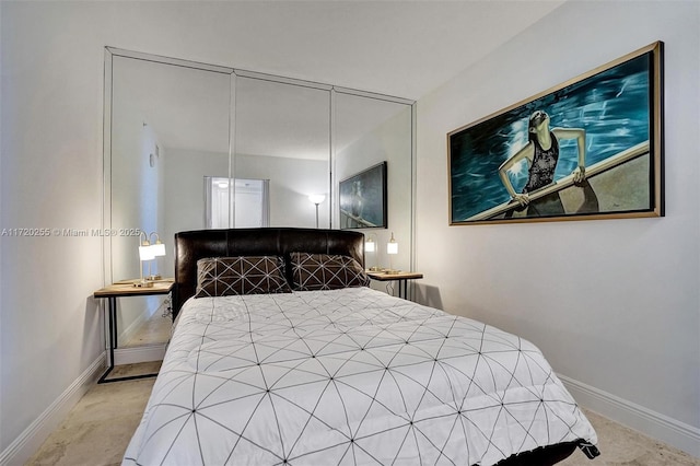 bedroom featuring light carpet and a closet