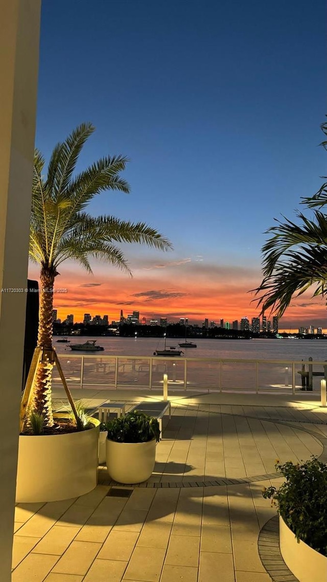 patio terrace at dusk with a balcony