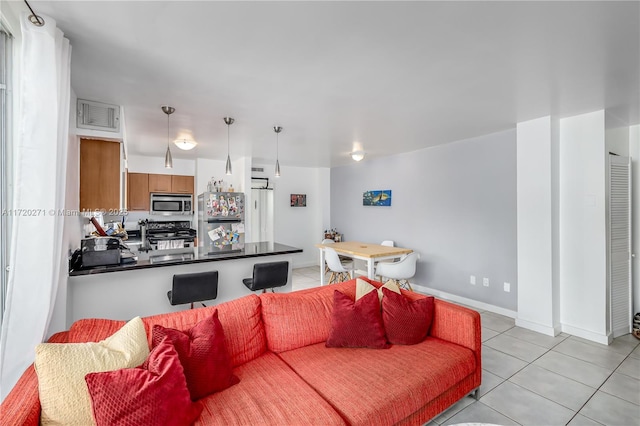 living room featuring light tile patterned flooring