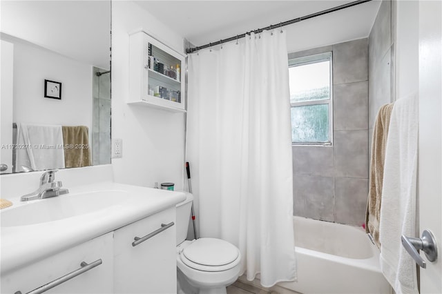 full bathroom featuring vanity, toilet, and shower / bathtub combination with curtain