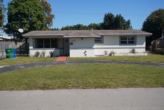 ranch-style house with a front yard