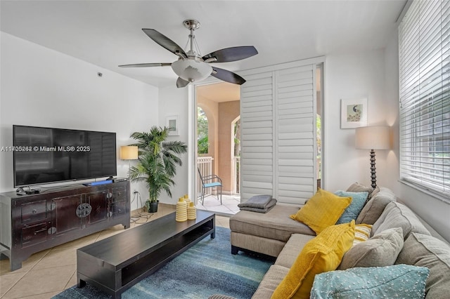 tiled living room featuring ceiling fan