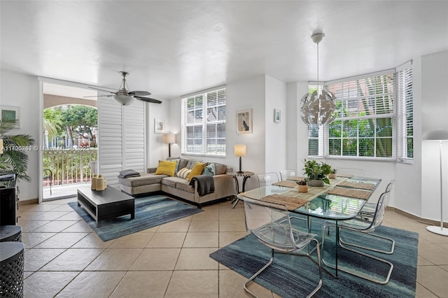 tiled living room featuring ceiling fan and plenty of natural light