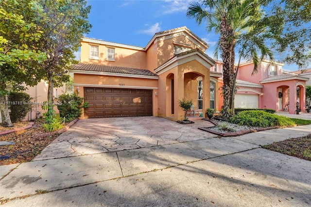 mediterranean / spanish house with a garage