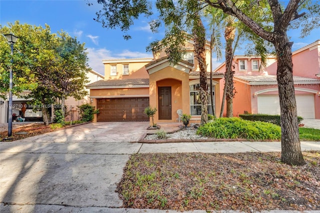 mediterranean / spanish-style home featuring a garage