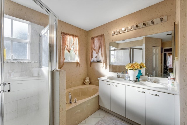 bathroom with tile patterned flooring, vanity, and plus walk in shower