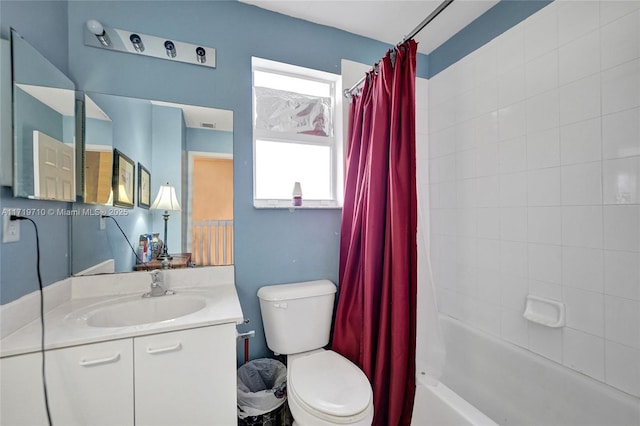 full bathroom with shower / tub combo with curtain, vanity, and toilet