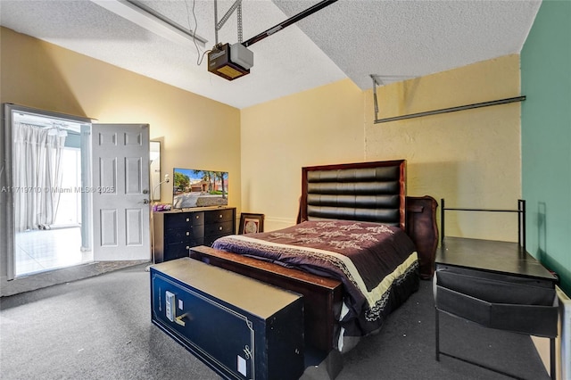 bedroom featuring carpet and a textured ceiling