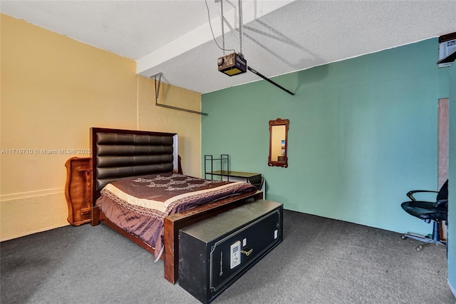 bedroom with carpet flooring and a textured ceiling