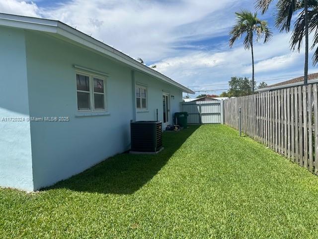 view of yard with central AC