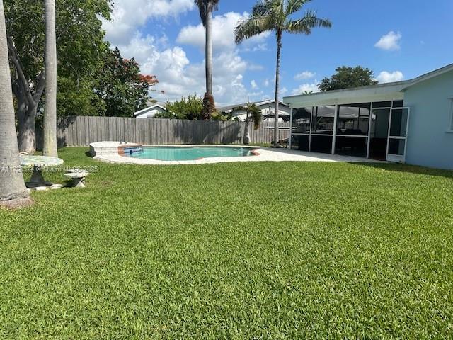 9920 SW 194th St, Cutler Bay, FL 33157 - view of yard featuring a sunroom