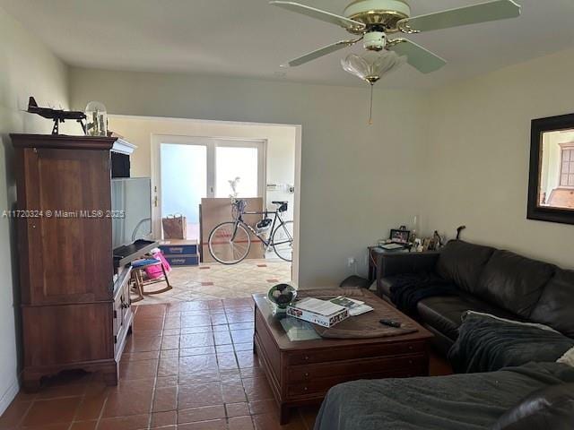 living room featuring tile patterned flooring and ceiling fan