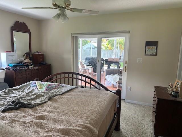 bedroom with access to outside, ceiling fan, and light colored carpet