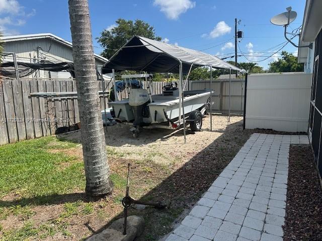9920 SW 194th St, Cutler Bay, FL 33157 - fenced backyard with a detached carport