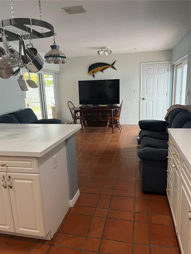 9920 SW 194th St, Cutler Bay, FL 33157 - kitchen featuring open floor plan, dark tile patterned flooring, and light countertops