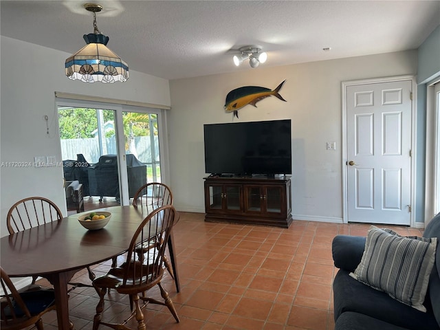 9920 SW 194th St, Cutler Bay, FL 33157 - dining space with tile patterned flooring, baseboards, and a textured ceiling