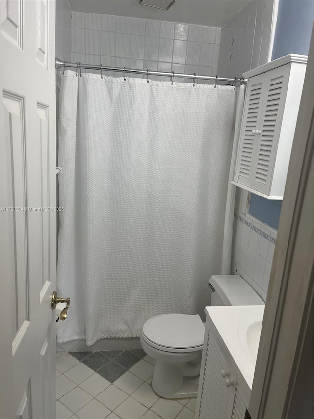 9920 SW 194th St, Cutler Bay, FL 33157 - full bathroom with tile patterned floors, toilet, vanity, and a shower with shower curtain