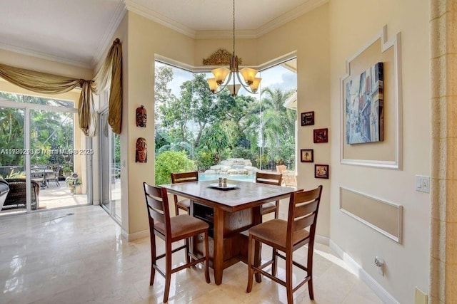 dining space with crown molding and an inviting chandelier