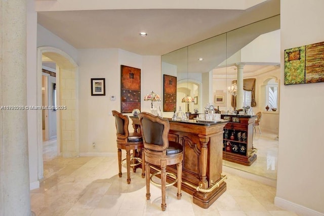 6139 Via Venetia S, Delray Beach, FL 33484 - bar featuring arched walkways, recessed lighting, and hanging light fixtures