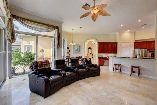 6139 Via Venetia S, Delray Beach, FL 33484 - living room featuring a chandelier, a ceiling fan, ornamental molding, recessed lighting, and arched walkways