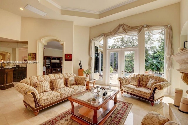 6139 Via Venetia S, Delray Beach, FL 33484 - living room with french doors, crown molding, arched walkways, and a tray ceiling