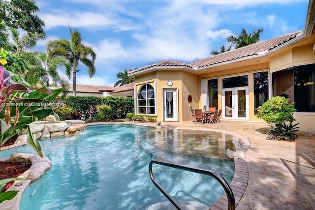 6139 Via Venetia S, Delray Beach, FL 33484 - view of swimming pool featuring french doors and a patio