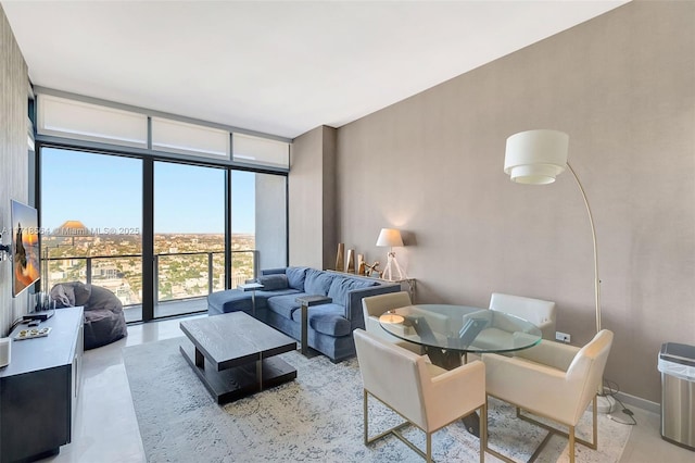 living room featuring floor to ceiling windows and a healthy amount of sunlight