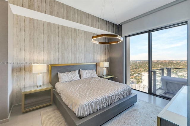 bedroom featuring wooden walls