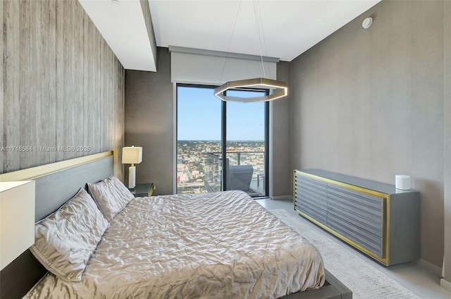 bedroom with floor to ceiling windows