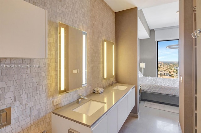 bathroom featuring vanity and tile walls