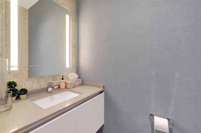 bathroom with backsplash and vanity