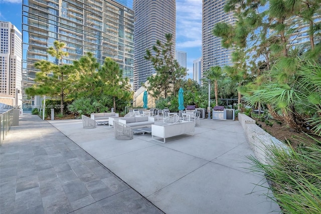 view of home's community featuring outdoor lounge area and a patio area