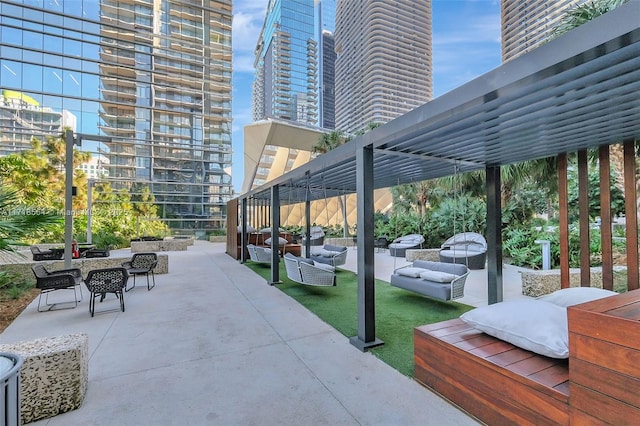 view of patio with a pergola and an outdoor hangout area