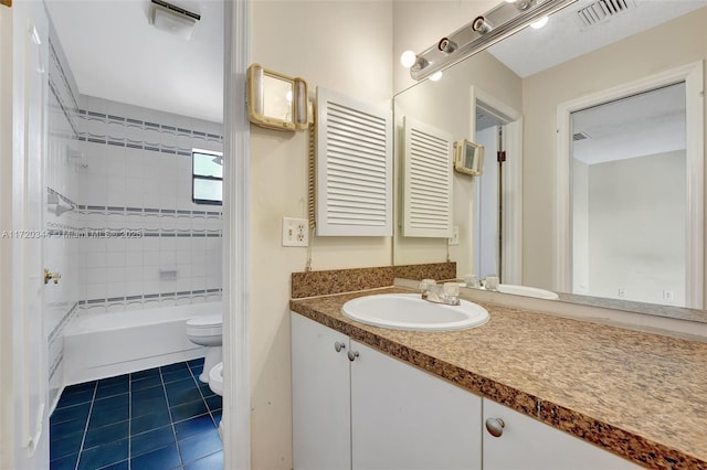 full bathroom featuring tile patterned floors, vanity, a bidet, toilet, and tiled shower / bath