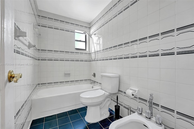 bathroom with tile patterned floors, tiled shower / bath combo, tile walls, a bidet, and toilet