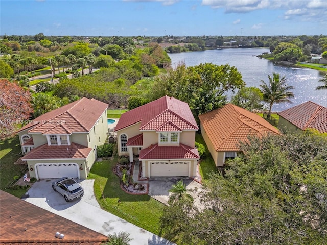 birds eye view of property with a water view