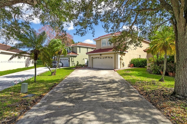 mediterranean / spanish-style home featuring a front yard and a garage