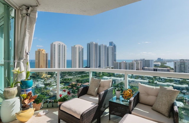 balcony featuring a water view