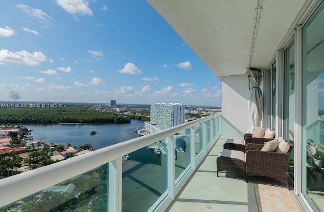 balcony featuring a water view