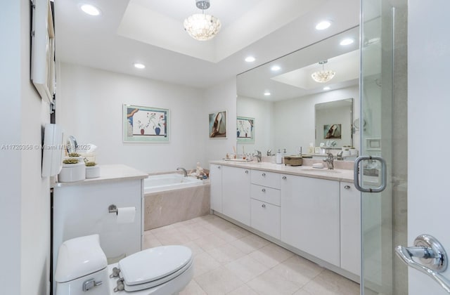 full bathroom with tile patterned floors, vanity, a raised ceiling, independent shower and bath, and toilet