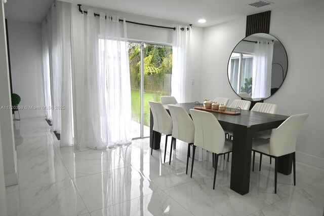 dining area with stacked washer / dryer